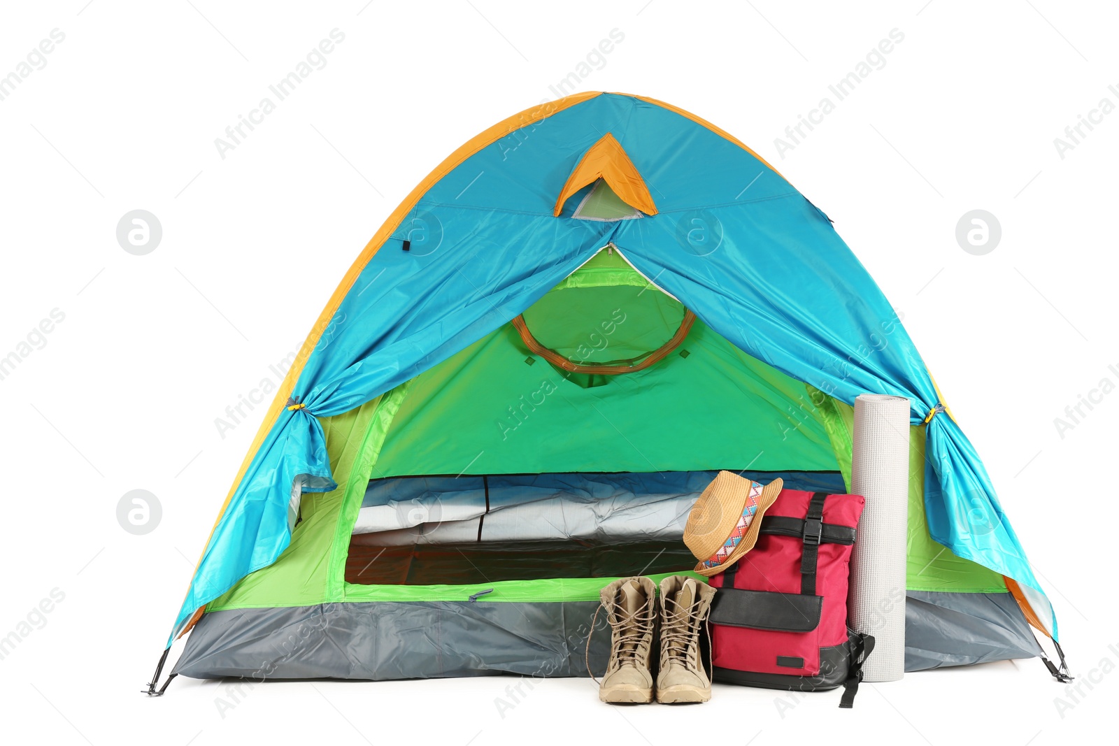 Photo of Colorful tent and camping equipment on white background