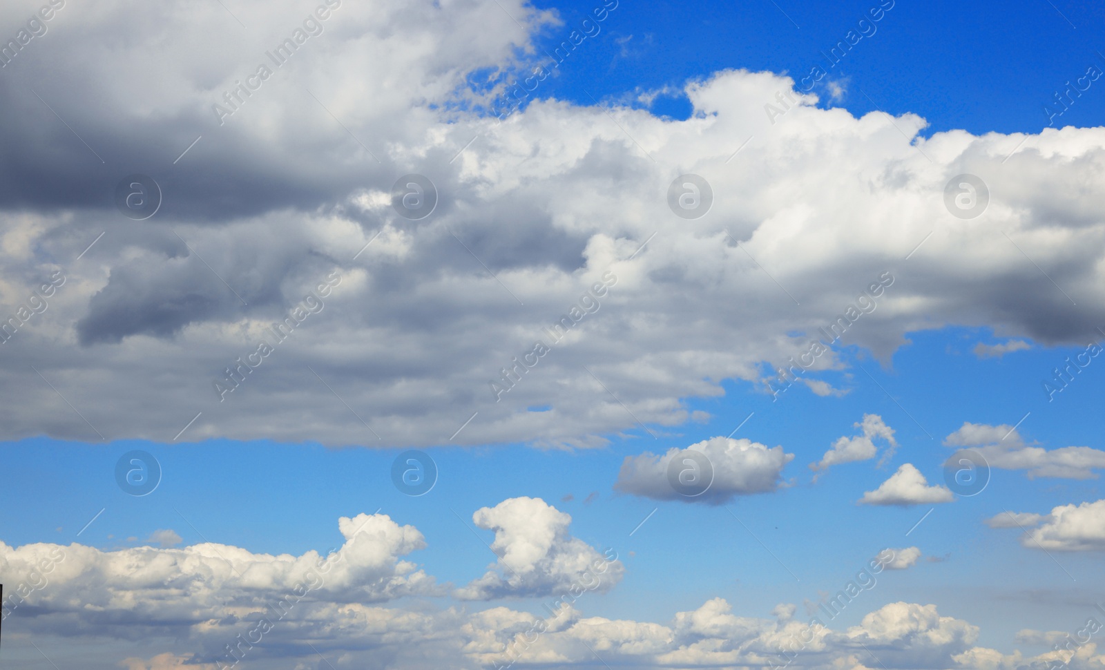 Photo of Picturesque view on beautiful cloudy sky and green field