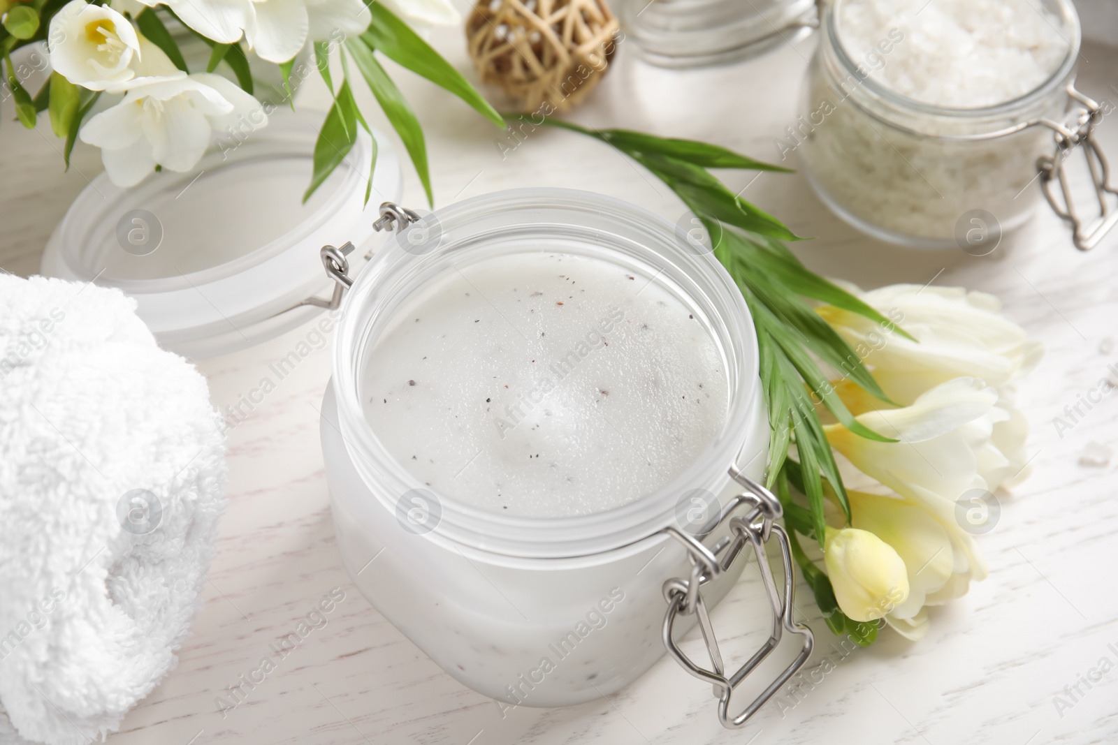 Photo of Composition with salt scrub on white wooden table