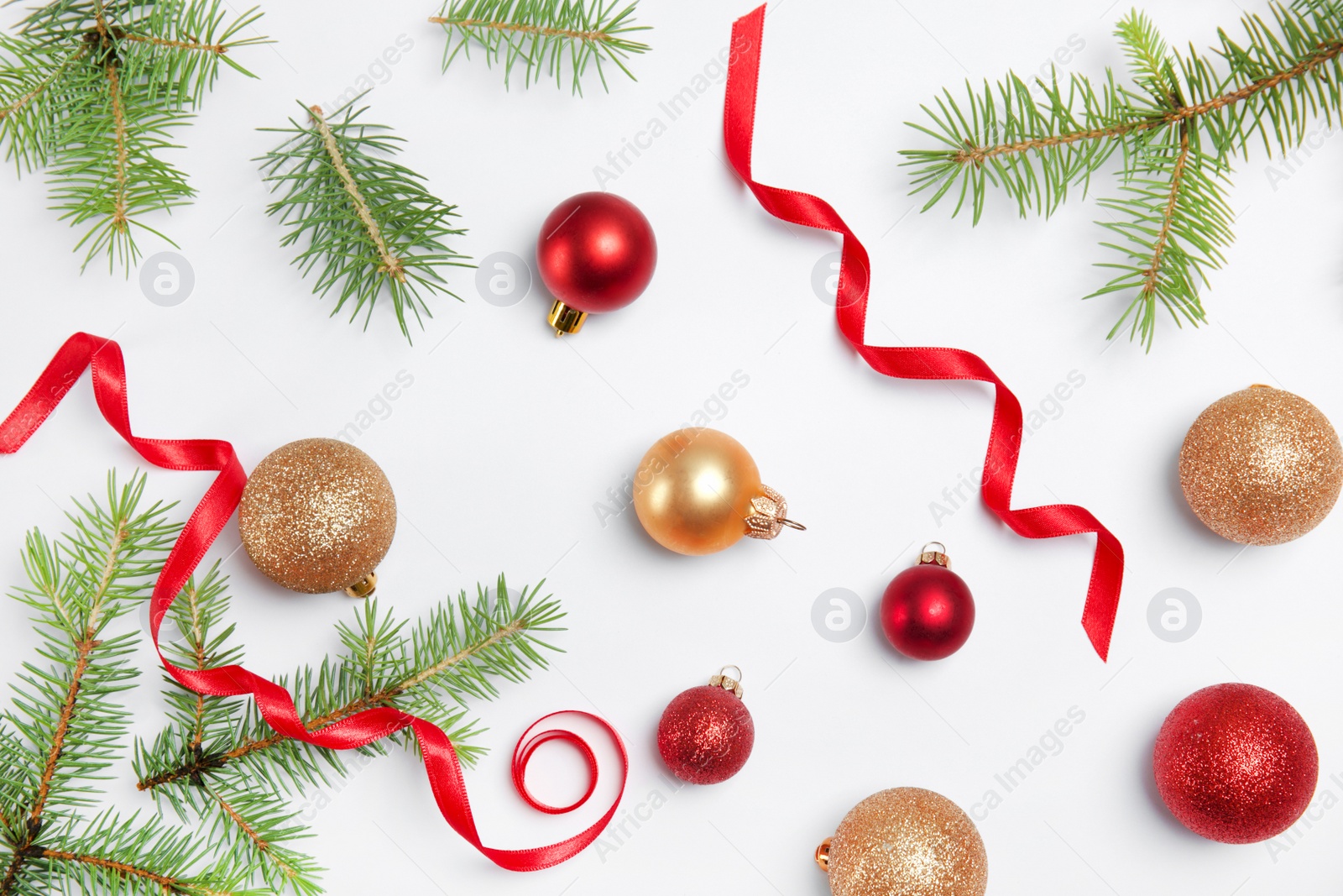 Photo of Composition with Christmas tree branches and festive decor on white background