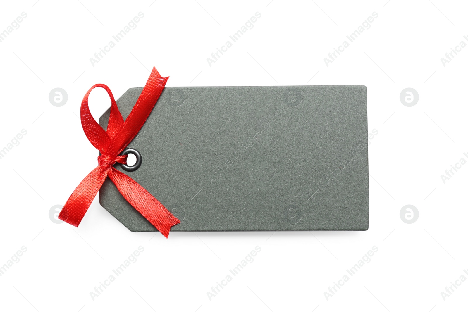 Photo of Blank grey gift tag with red satin ribbon on white background, top view. Space for design