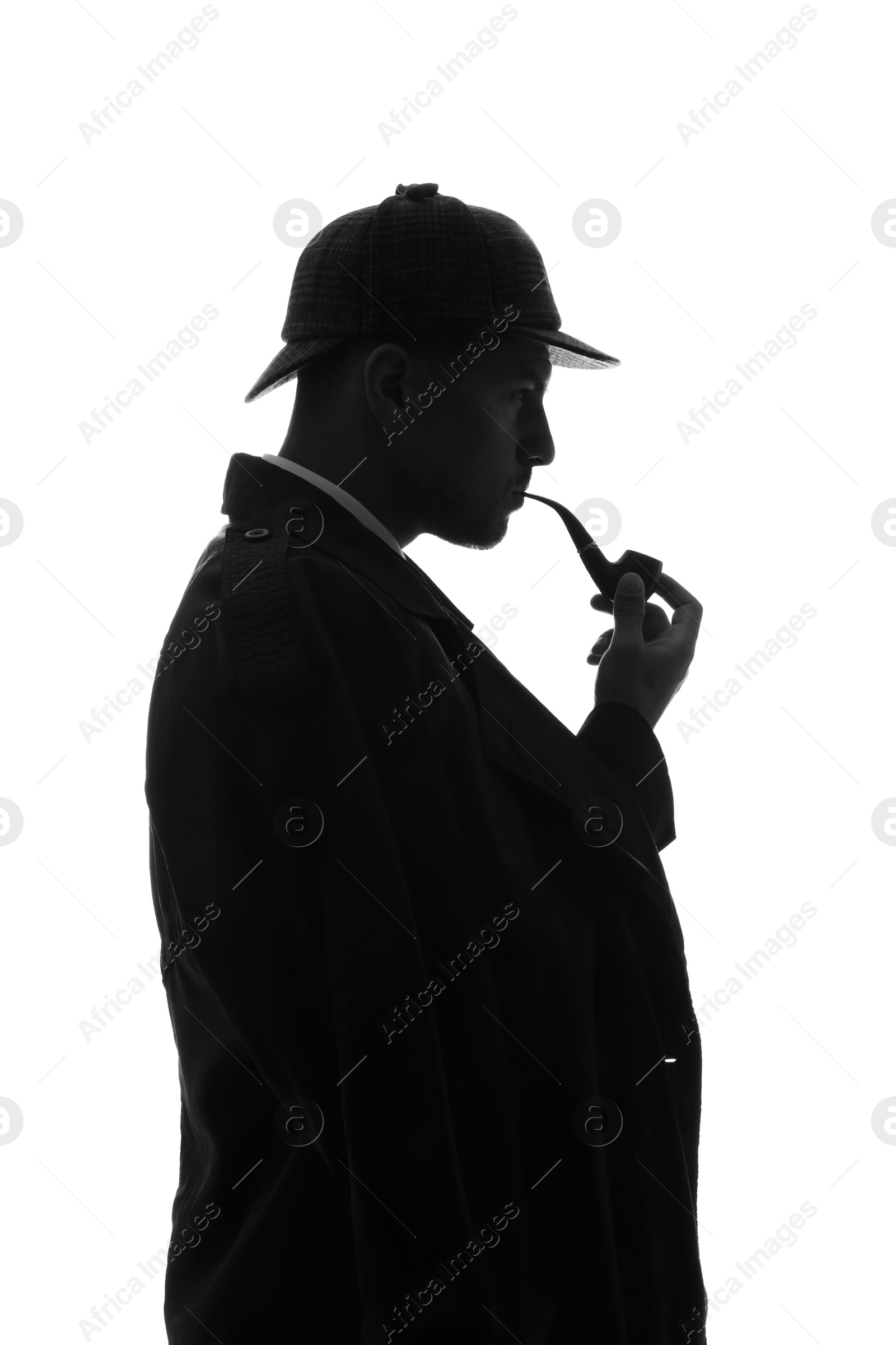 Photo of Old fashioned detective with smoking pipe on white background