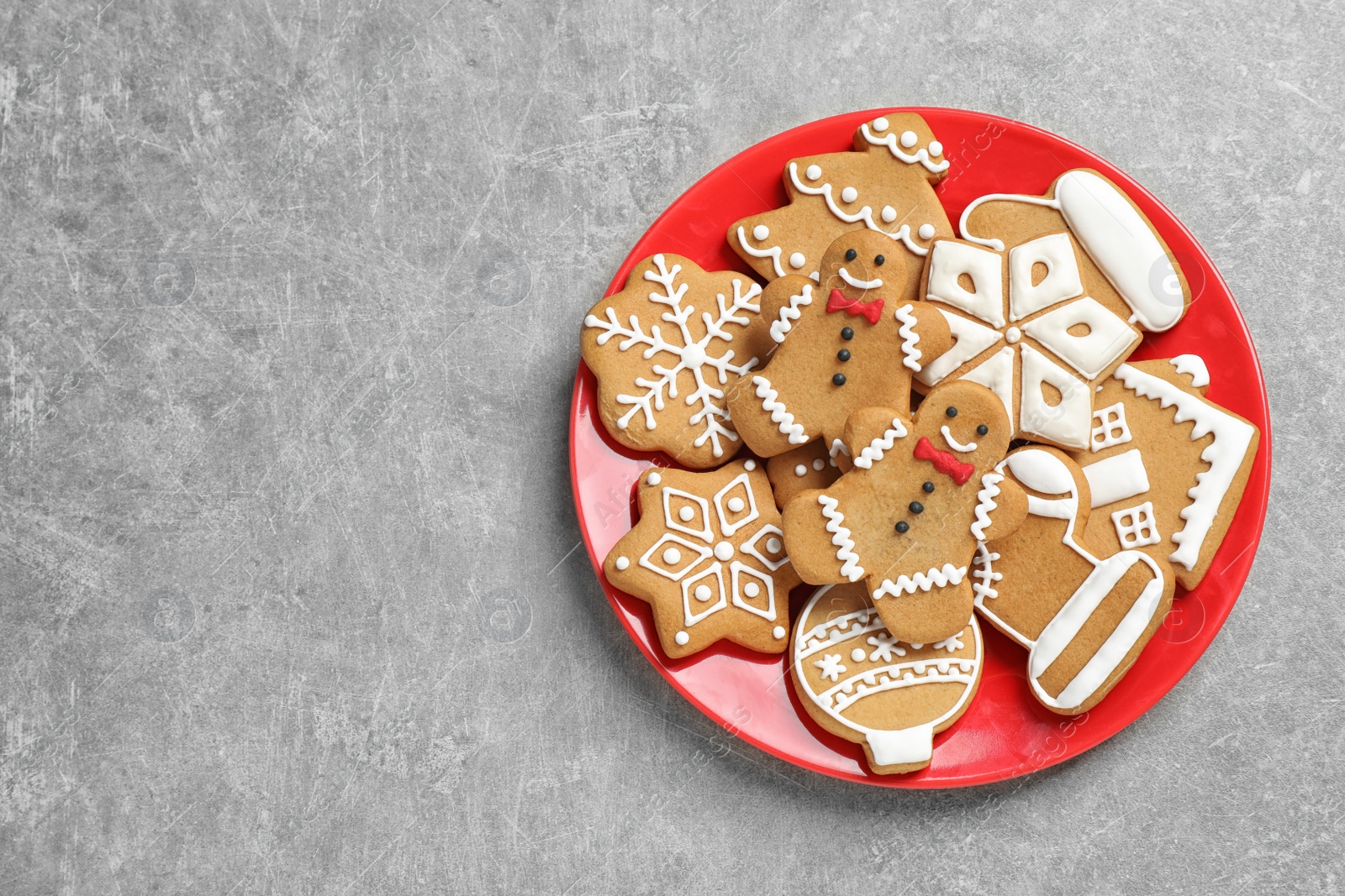 Photo of Tasty homemade Christmas cookies on grey table, top view. Space for text