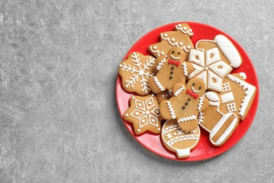 Photo of Tasty homemade Christmas cookies on grey table, top view. Space for text