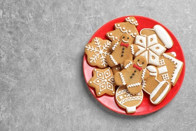 Tasty homemade Christmas cookies on grey table, top view. Space for text