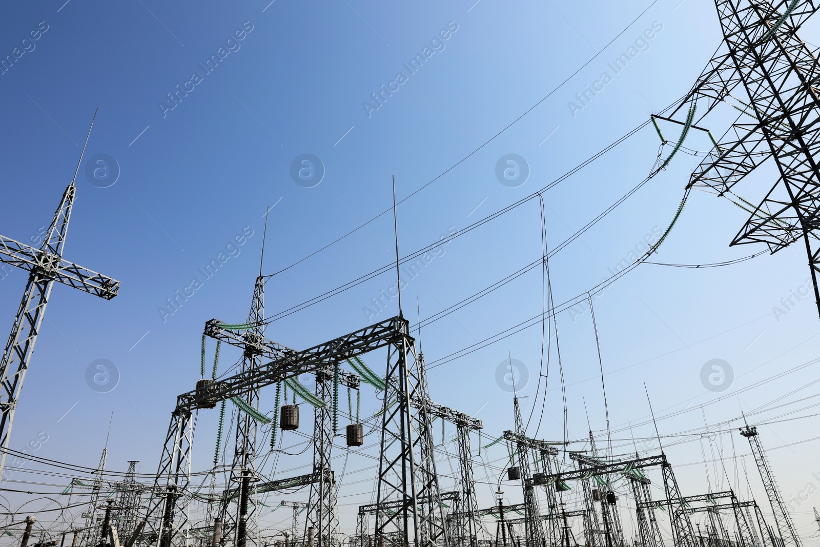 Photo of Modern electrical substation on sunny day, low angle view