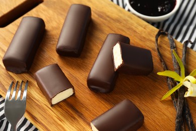 Photo of Glazed vanilla curd cheese bars served on table, closeup