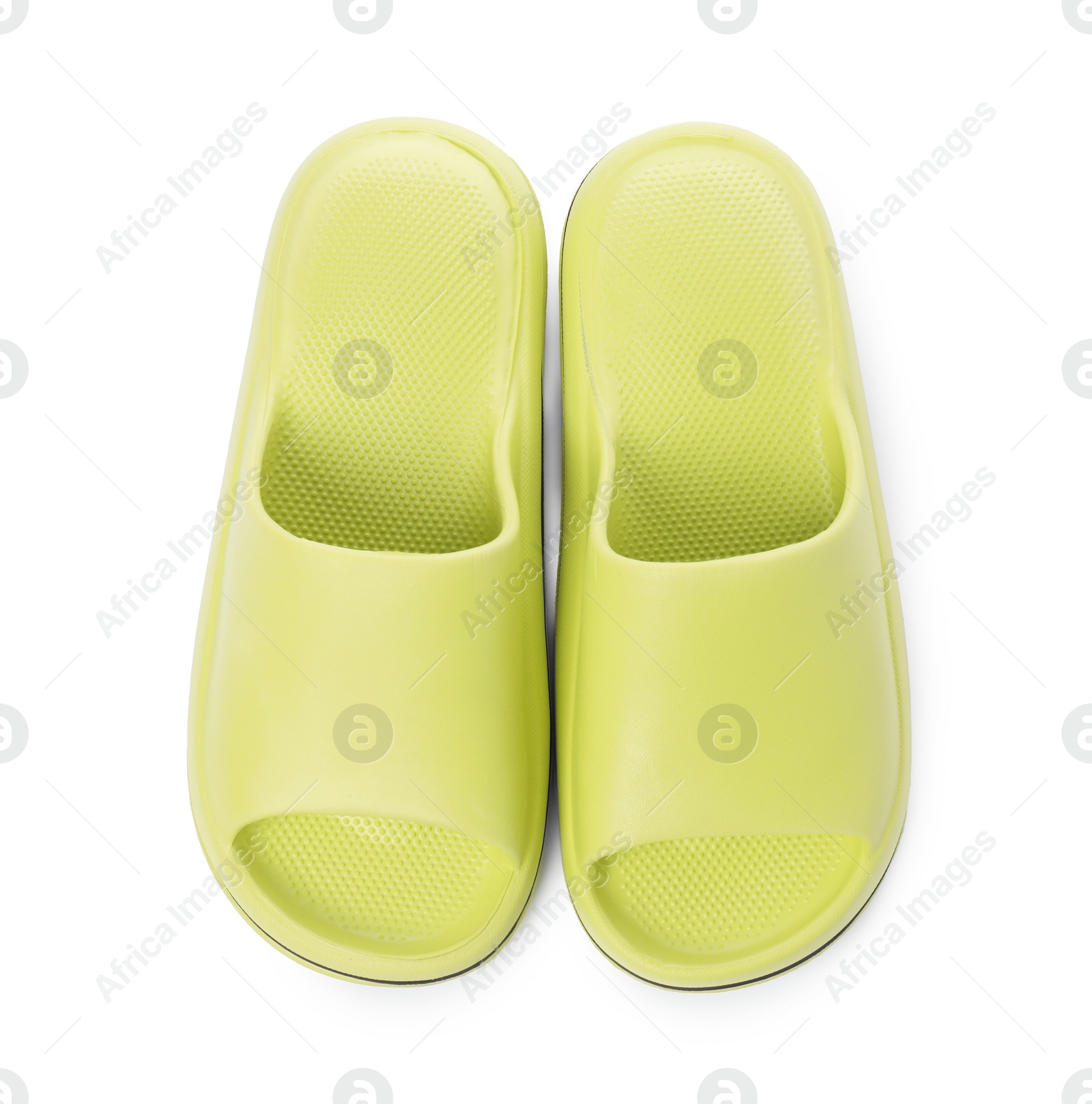 Photo of Pair of green rubber slippers isolated on white, top view