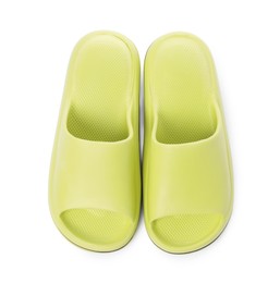 Pair of green rubber slippers isolated on white, top view