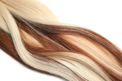 Photo of Strands of different color hair on white background