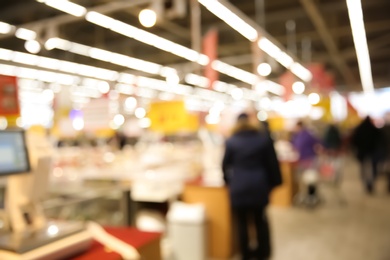 Blurred view of modern supermarket interior