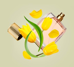 Bottle of perfume and tulips in air on light olive background
