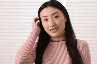 Photo of Portrait of smiling confident businesswoman in office