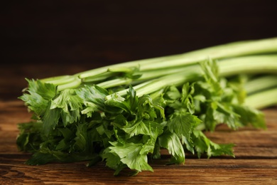 Fresh ripe green celery on wooden table, closeup