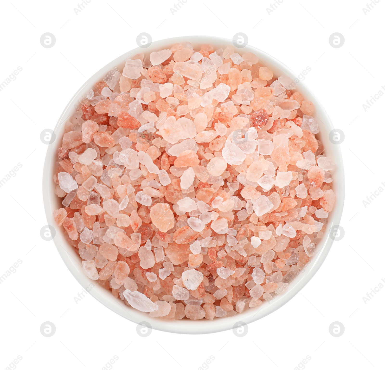 Photo of Pink Himalayan salt in bowl isolated on white, top view