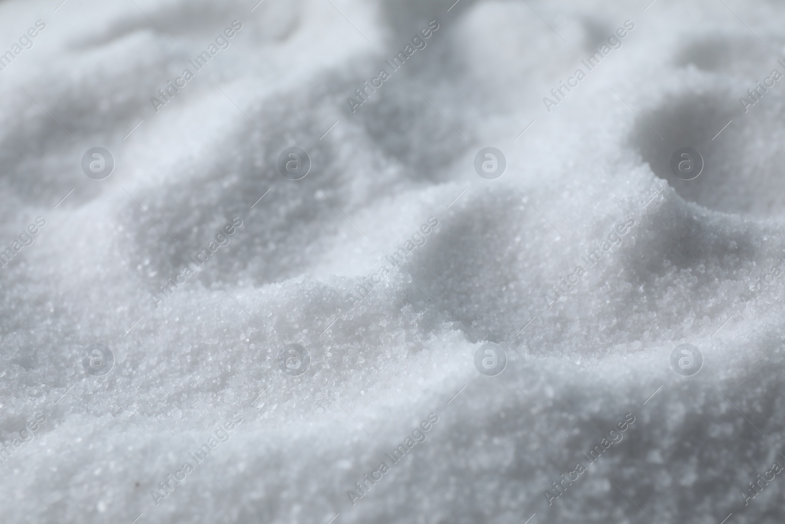 Photo of Organic white sea salt as background, closeup