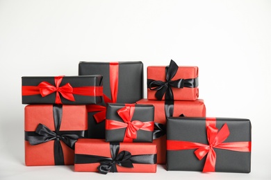 Many gift boxes on white background. Black Friday