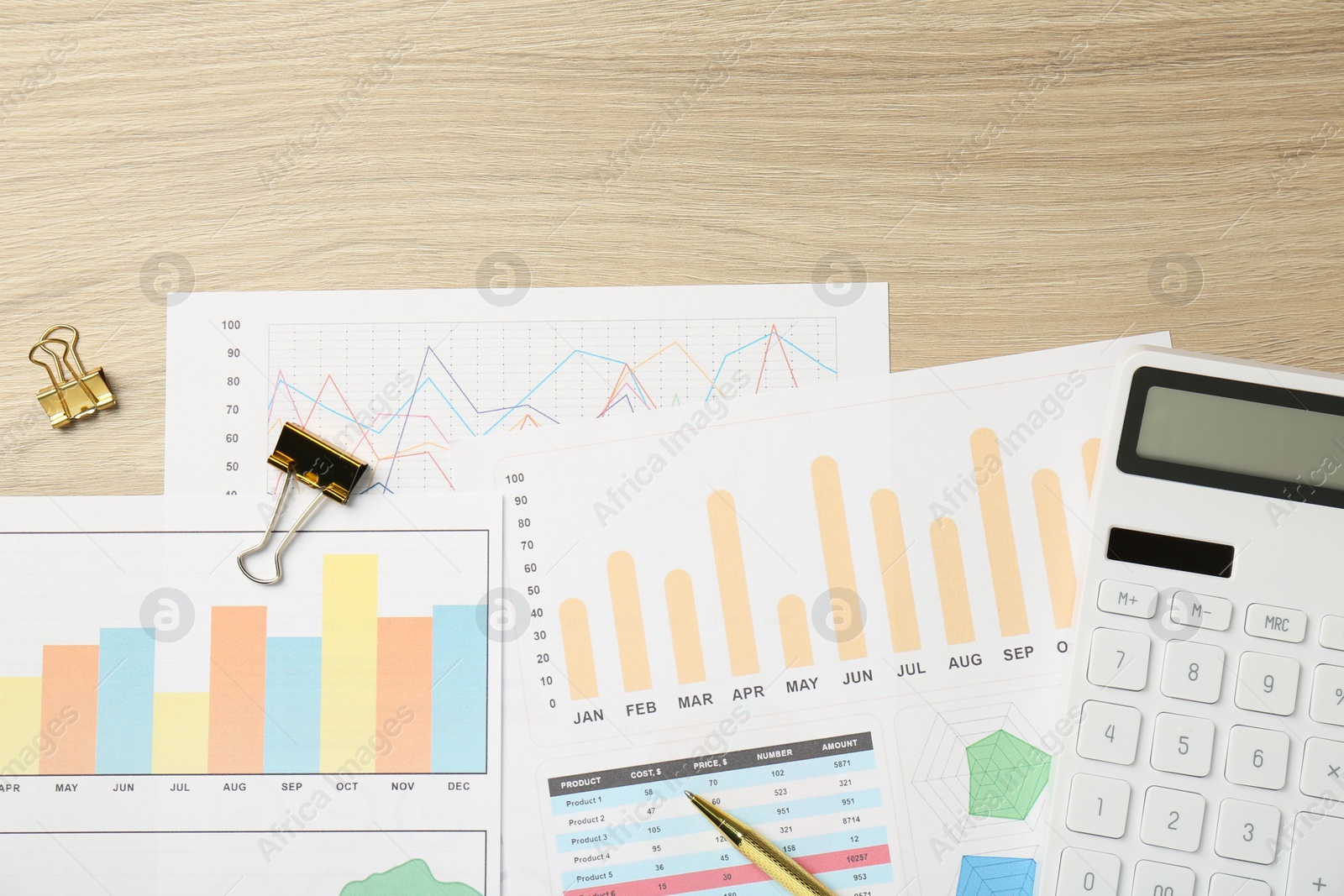 Photo of Accounting documents, calculator, pen and binder clips on wooden table, flat lay