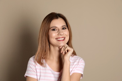 Photo of Smiling woman with perfect teeth on color background