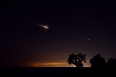 Image of Beautiful view of shooting star in night sky
