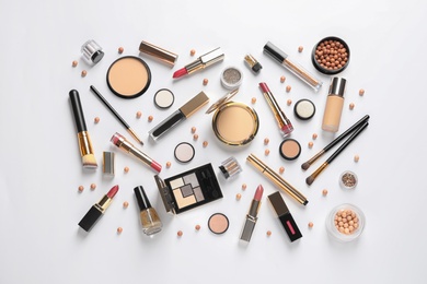 Set of luxury makeup products on white background, top view