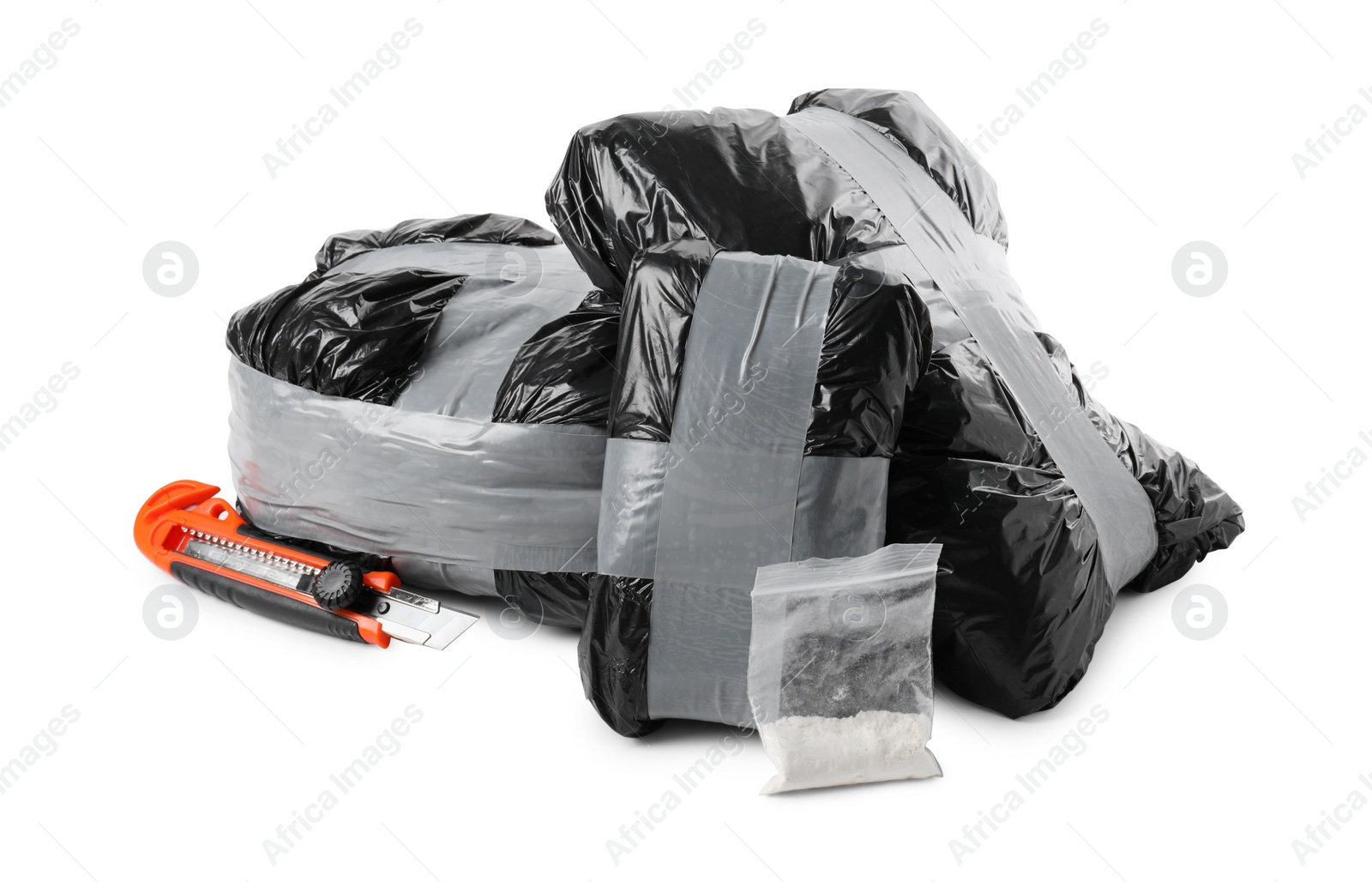 Photo of Packages with narcotics and stationery knife isolated on white