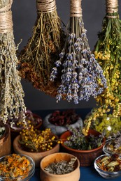 Photo of Many different herbs and flowers on grey background, closeup