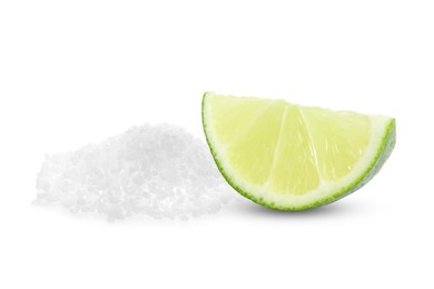 Image of Cut lime and salt isolated on white. Margarita cocktail ingredients