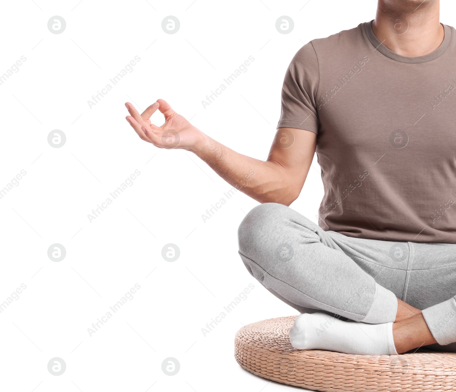 Photo of Man meditating on white background, closeup. Harmony and zen