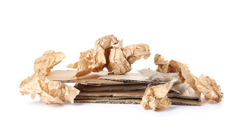 Photo of Pile of paper and cardboard garbage on white background. Recycling problem