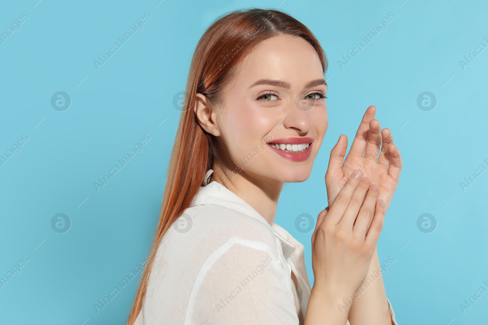 Photo of Beautiful young woman on light blue background