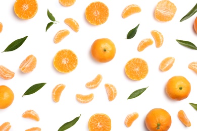 Photo of Composition with tangerines and leaves on white background, top view