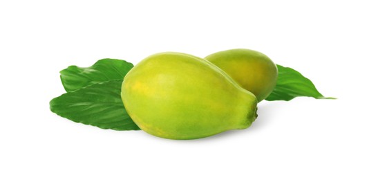 Photo of Fresh ripe papaya fruits with green leaves on white background