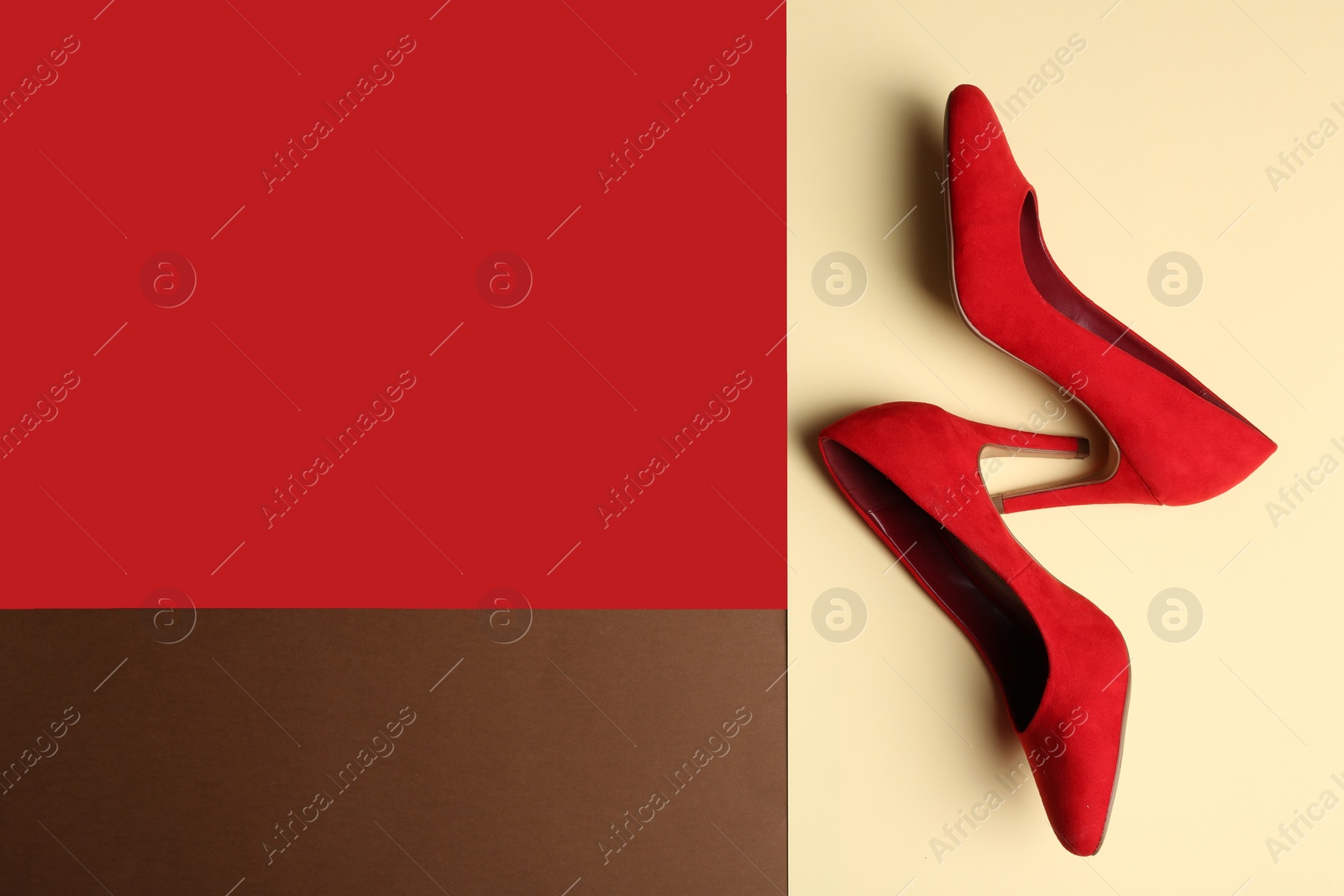 Photo of Stylish high heel shoes on color background, top view. Space for text