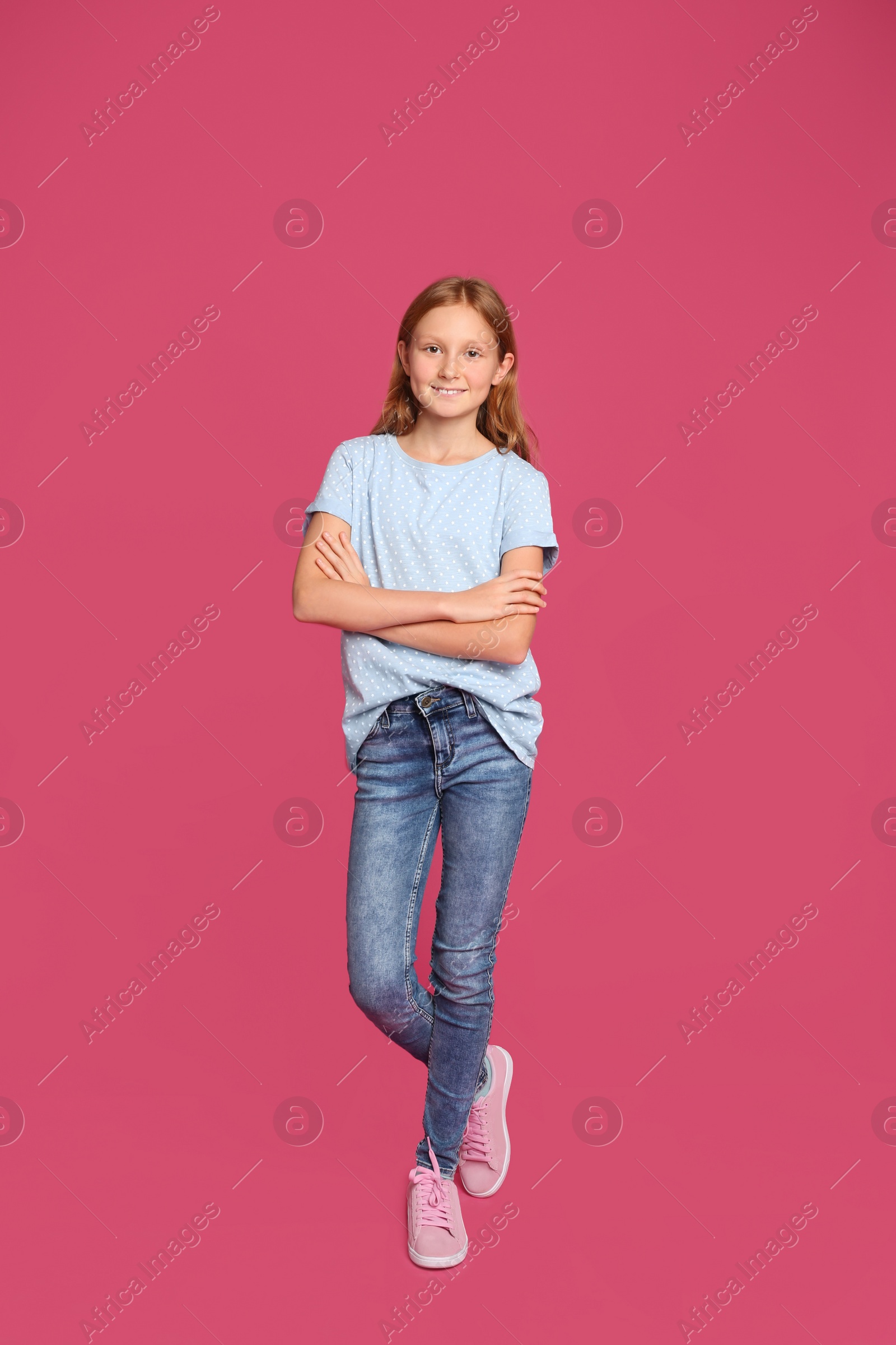 Photo of Full length portrait of preteen girl on pink background