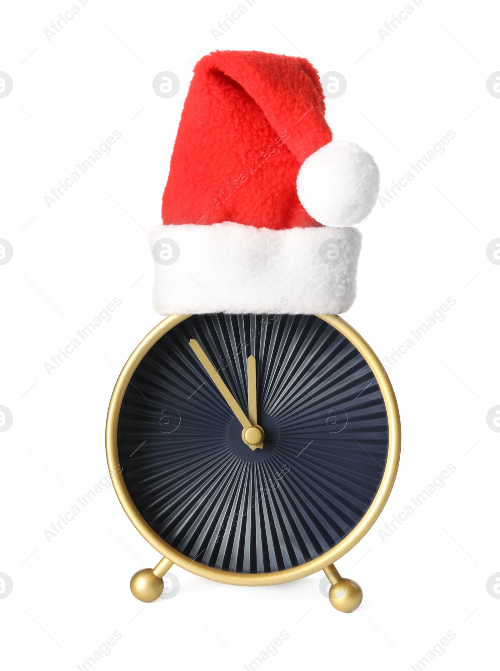 Photo of Alarm clock with Santa hat on white background. New Year countdown