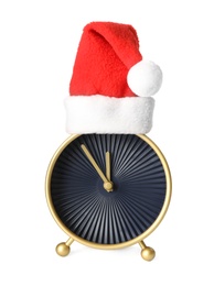 Photo of Alarm clock with Santa hat on white background. New Year countdown