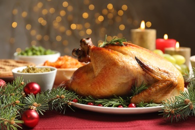 Photo of Traditional festive dinner with delicious roasted turkey served on table