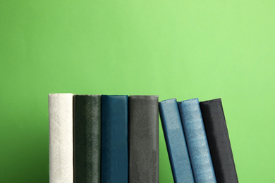 Collection of old books on green background