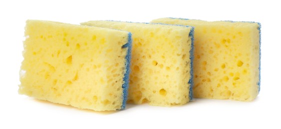 Photo of Yellow cleaning sponges with abrasive light blue scourers on white background