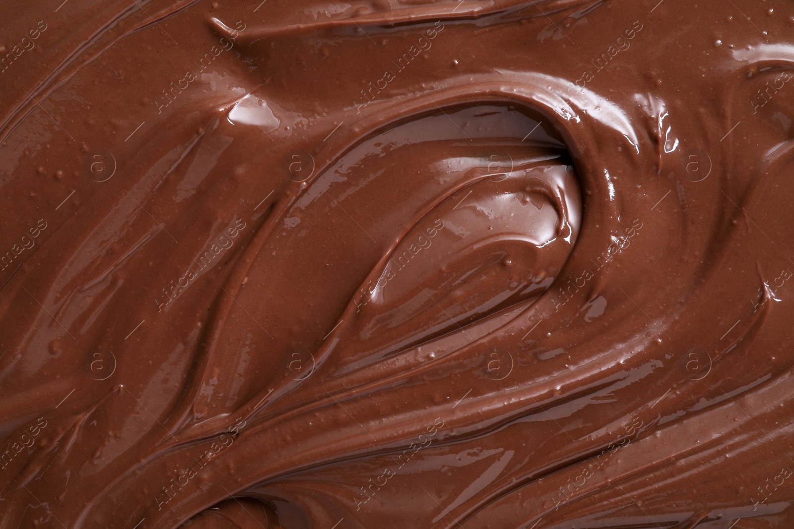 Photo of Tasty chocolate paste as background, closeup view