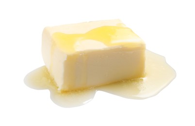 Photo of Piece of melting butter on white background