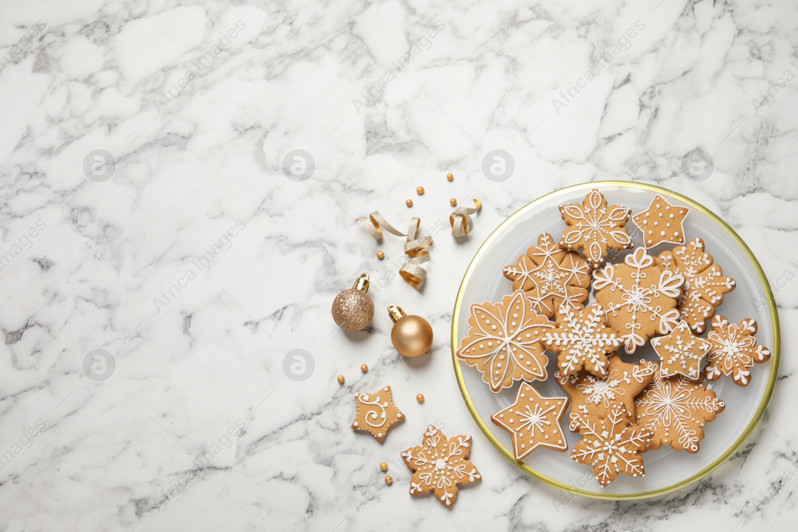 Photo of Tasty Christmas cookies and baubles on white marble table, flat lay. Space for text