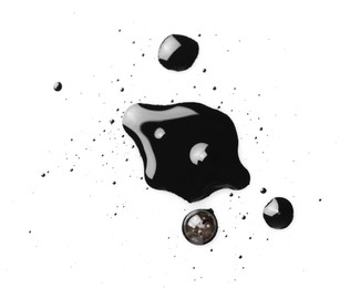 Blobs of black oil isolated on white, top view