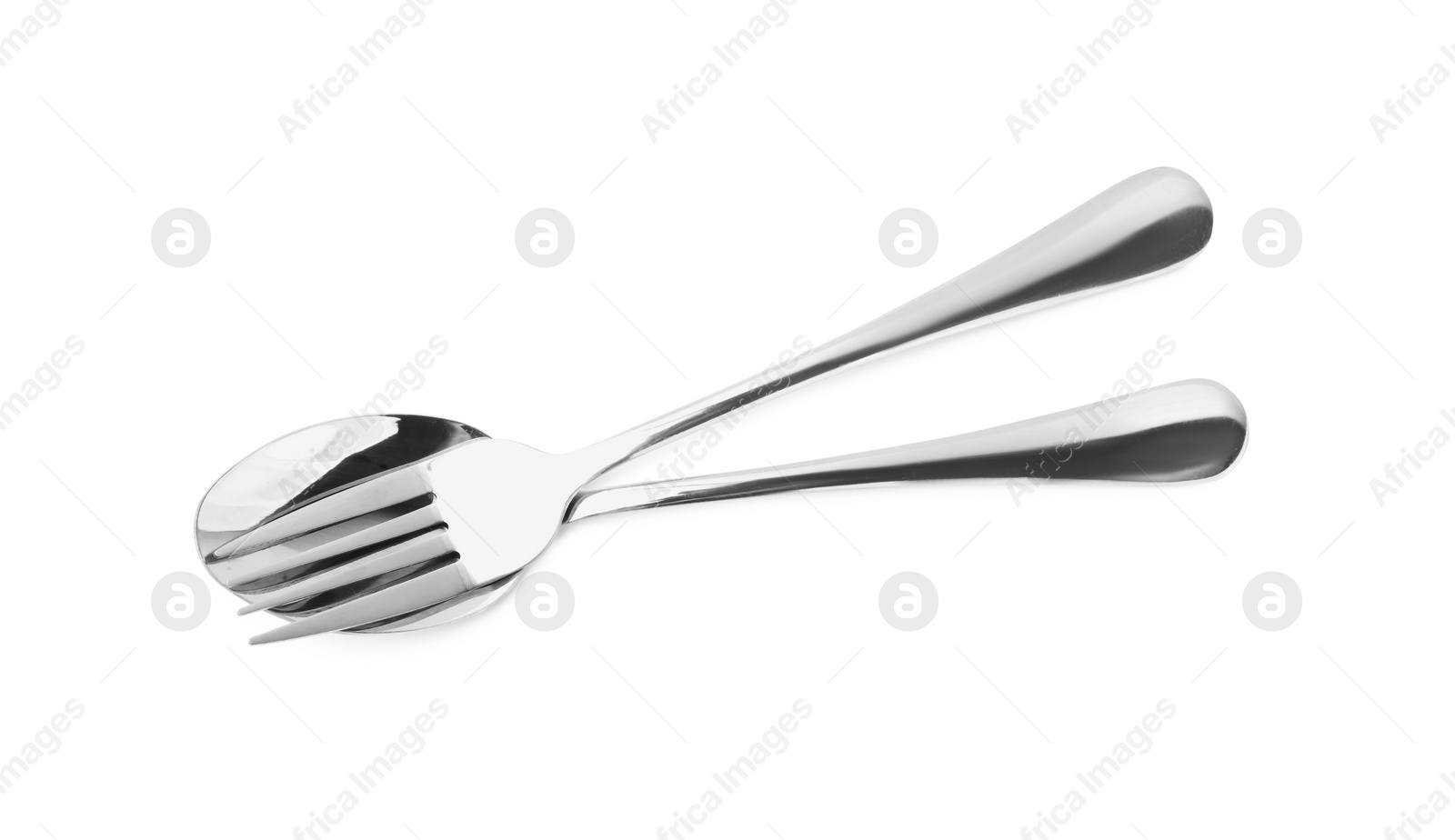 Photo of Clean shiny fork and spoon isolated on white. Cooking utensils