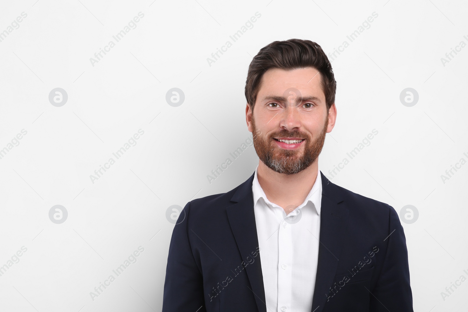 Photo of Portrait of handsome man on white background, space for text