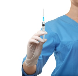 Female doctor with syringe on white background, closeup. Medical object