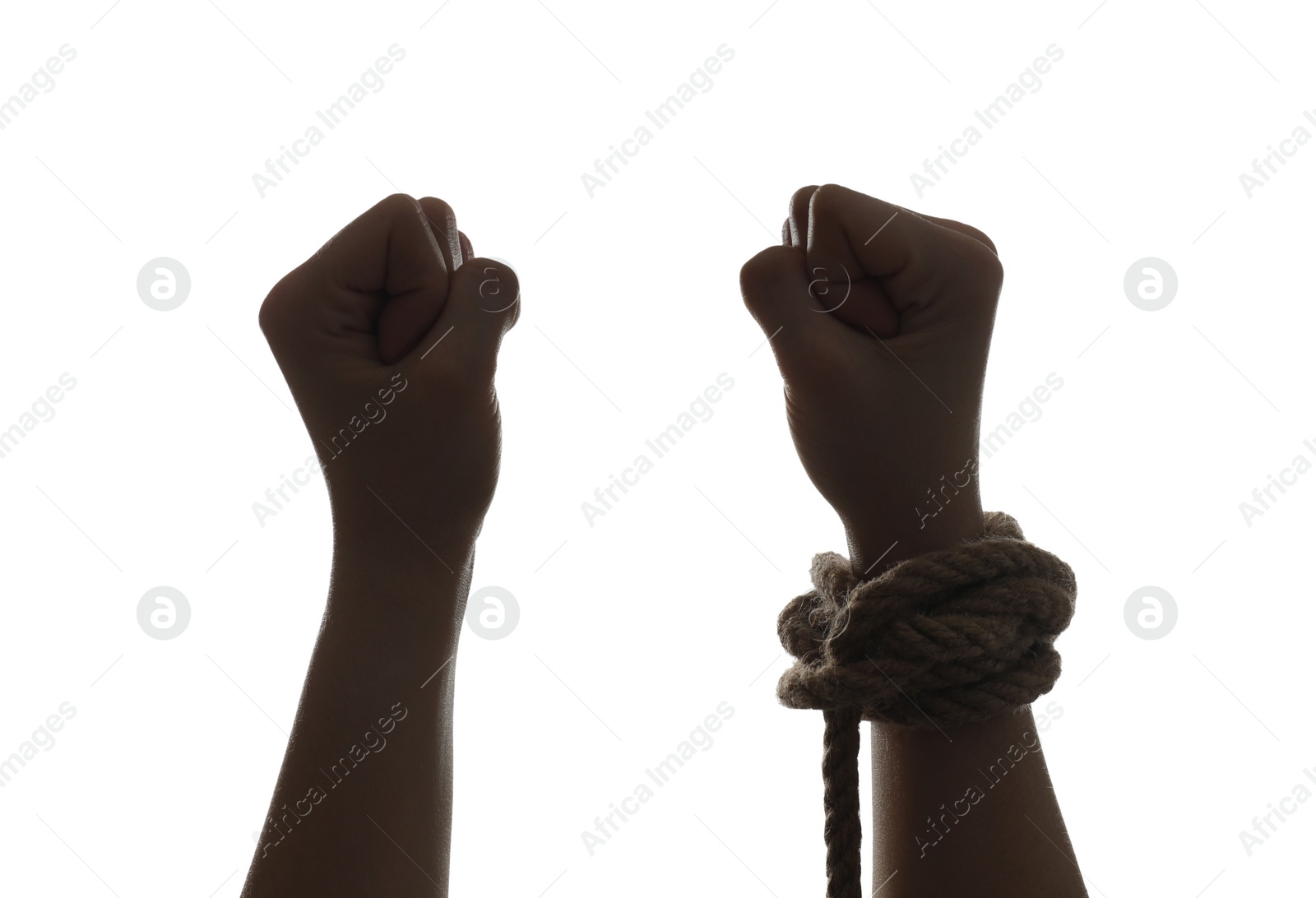 Photo of Freedom concept. Woman with rope on her hand against white background, closeup