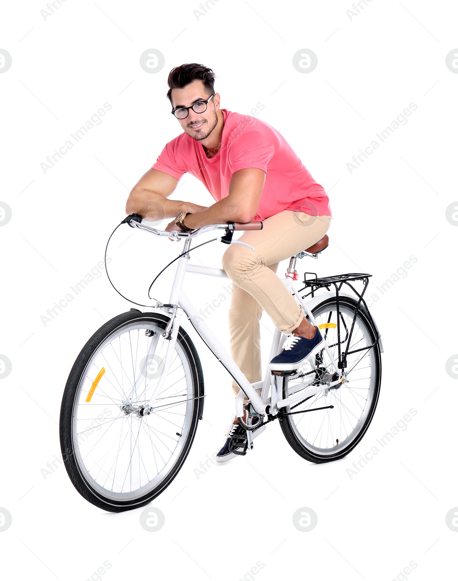 Photo of Handsome young hipster man with bicycle on white background