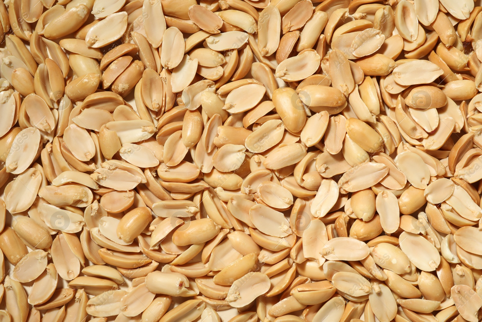 Photo of Fresh peeled peanuts as background, top view